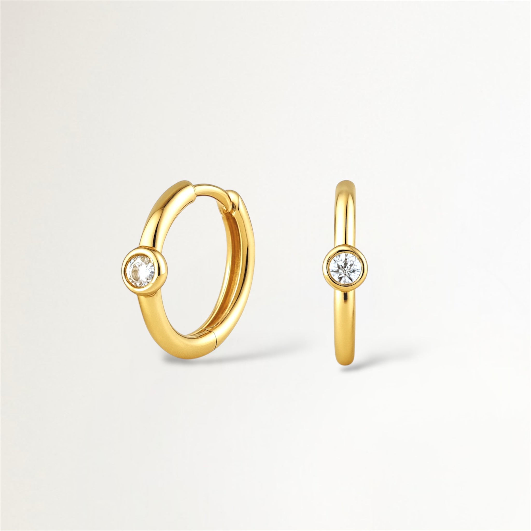 ARGOLLAS DORADAS CON CIRCON CENTRAL ENGASTADO